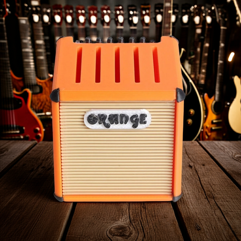 Support de mediators guitare sur une table en bois 